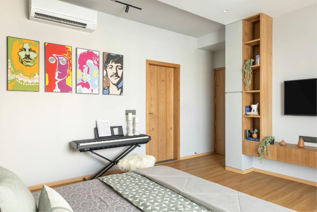 The son's bedroom — wardrobe wall in natural oak, open shelving with books and plants, TV unit